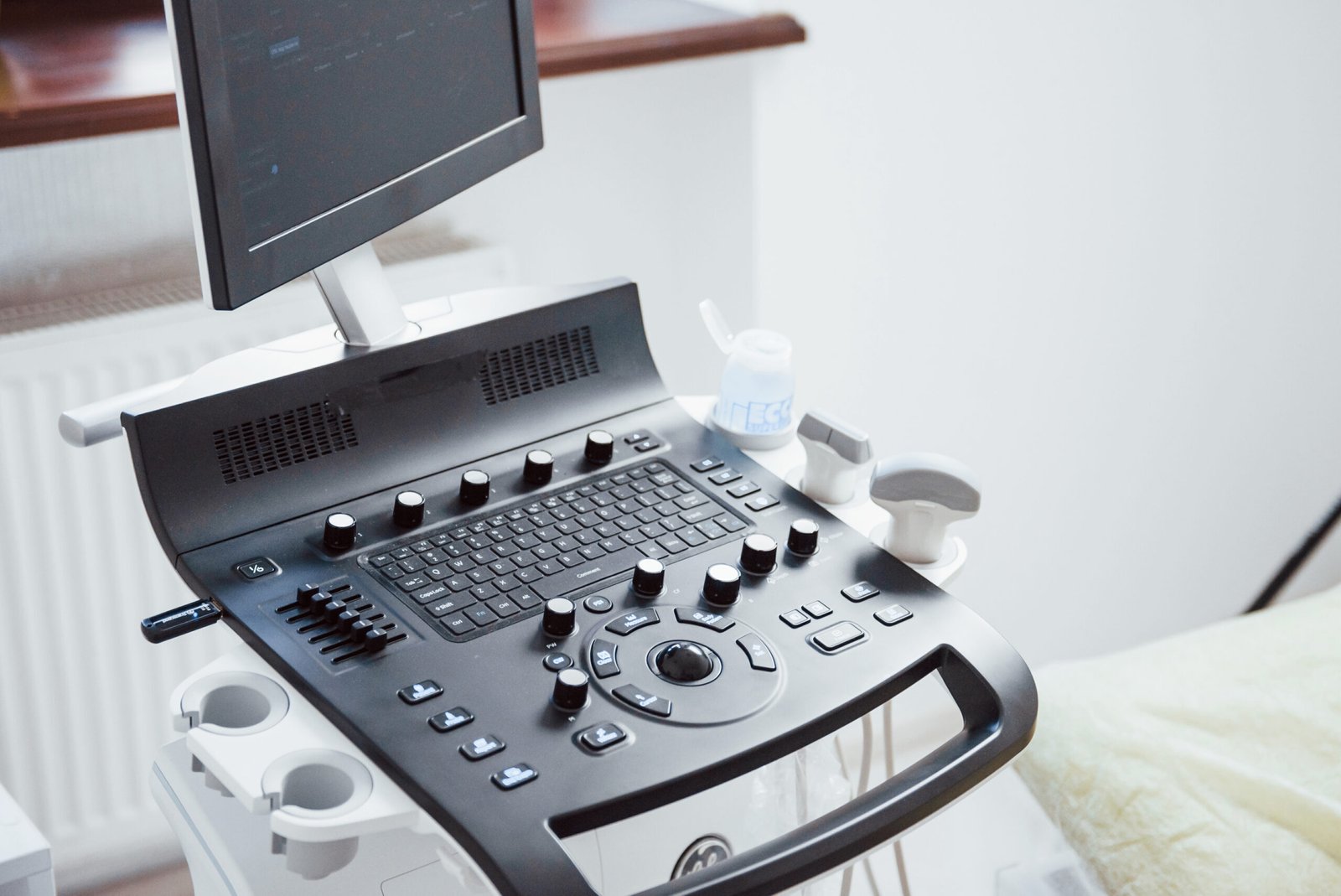Close up view of control desk of ultrasound device in the clinic Close up view of control desk of ultrasound device in the clinic