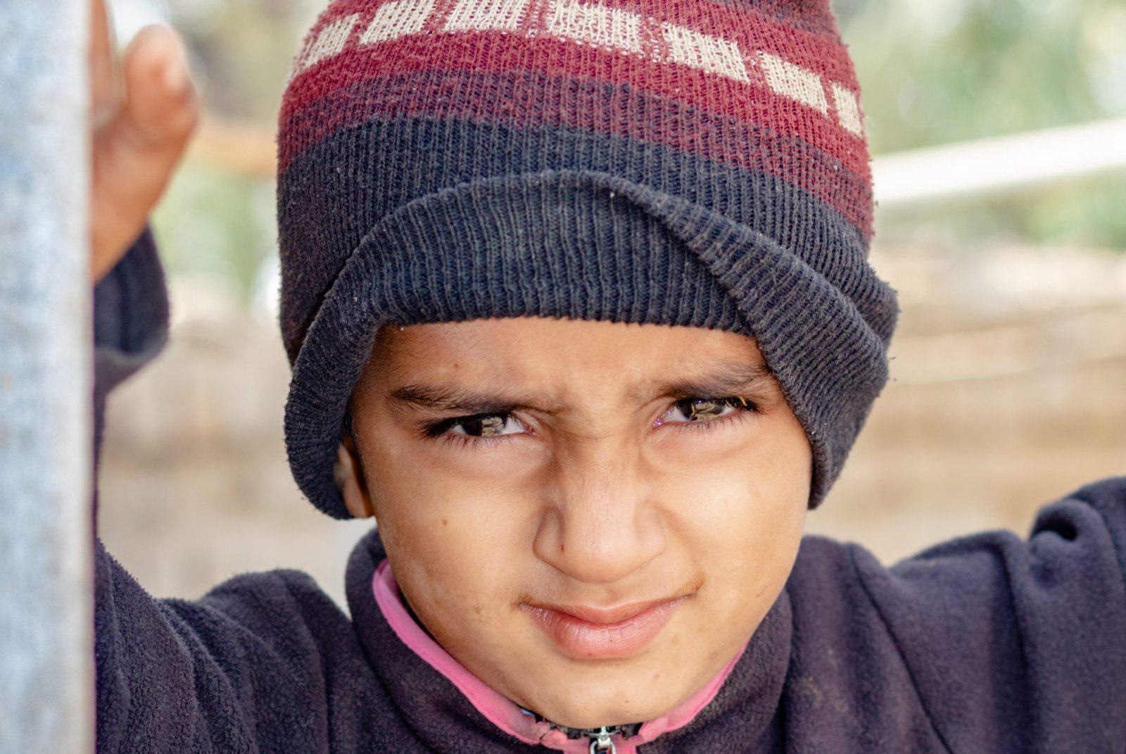 a child with a sad expression cause of flood and homelessness situation
